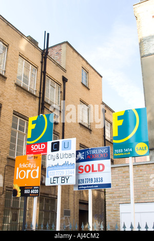 Estate agents for sale boards in Shoreditch London Stock Photo