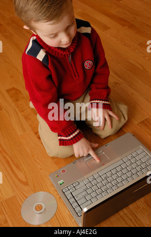 Young boy age 5 working on a latop computer Sherwood Park Alberta Canada Stock Photo