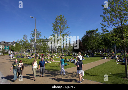 people enjoying the sunshine walking in Eyre Square in the heart of Galway city county Galway Republic of Ireland Stock Photo