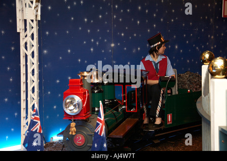 Children on department store magical Christmas train ride in Sydney New South Wales NSW Australia Stock Photo