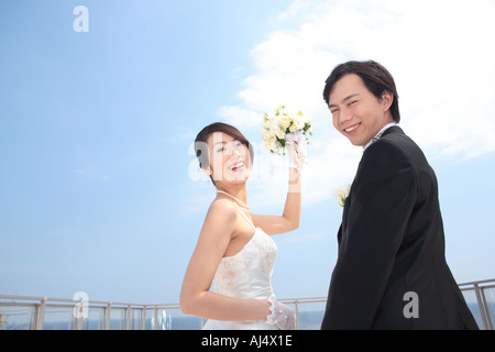 Bride and groom looking at camera Stock Photo