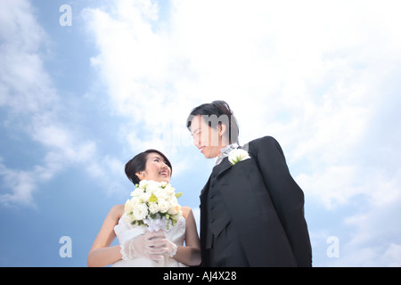 Bride and groom looking at each other Stock Photo