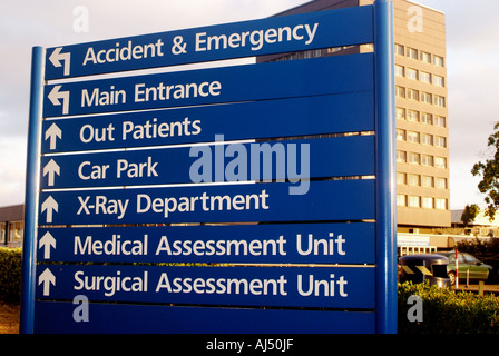 Hospital directions board directing patients to various clinical departments. Stock Photo