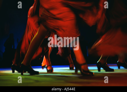 Spain Flamenco dance on stage live performance flamenco feet and swirling red dresses Andalucia Andalusia Spain Stock Photo