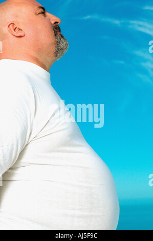 Profile of an overweight man Stock Photo