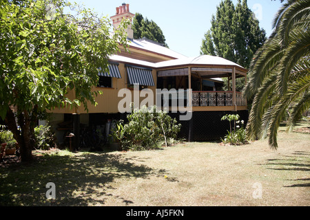 Exterior of old colonial style Queenslander wooden house building with gardens in Dakabin Queensland QLD Australia Stock Photo