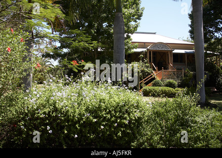 Exterior of old colonial style Queenslander wooden house building with gardens in Dakabin Queensland QLD Australia Stock Photo