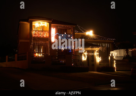House lit up with christmas light decorations in Brisbane Queensland QLD Australia Stock Photo