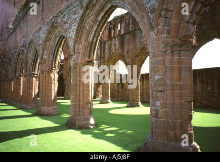 View through the arches on the north side of the nave of Sweetheart Abbey Church in New Abbey, Dumfries and Galloway, Scotland. Stock Photo