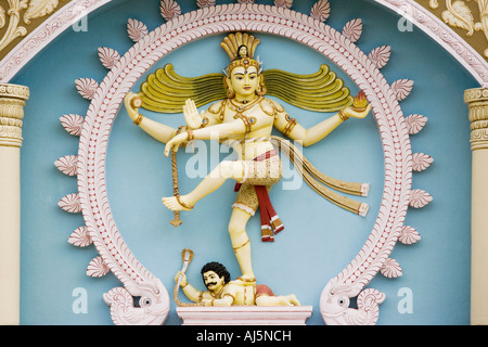 Dancing shiva nataraja statue on the exterior of a university building  in the town of Puttaparthi, Andhra Pradesh, India Stock Photo
