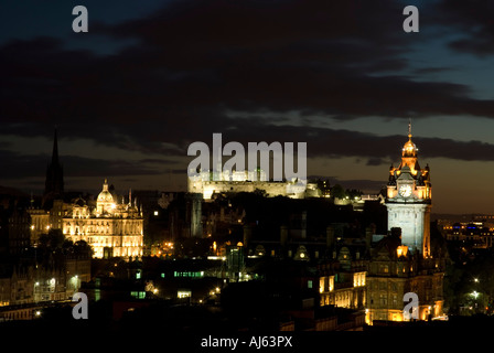 A nighttime Edinburgh cityscape showing Edinburgh Castle the Balmoral Hotel clock tower and the Bank of Scotland Head Office Stock Photo