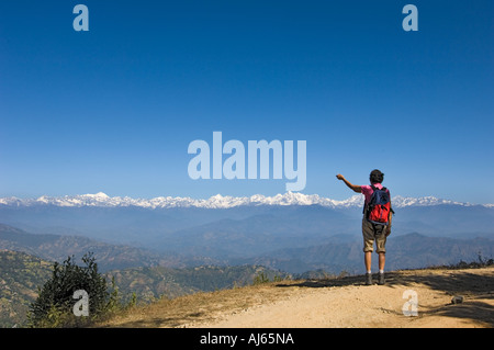 woman shows NAGARKOT HIMALAYA Resort mountain range of hills   Kathmandu valley NEPAL Asia Katmandu anapurna range trekki Stock Photo