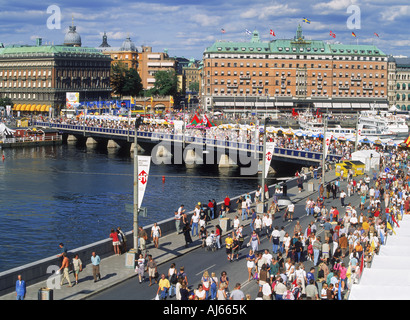 Summer visitors passing over bridges and streets near Old Town in Stockholm Stock Photo