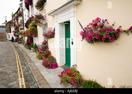 UK Kent Deal Beach Street seafront colourful floral display outside guest house doorway Stock Photo