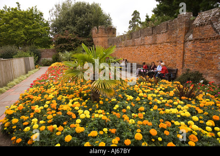 UK, West Sussex Chichester Bishops Palace Garden office workers taking lunch in walled garden Stock Photo