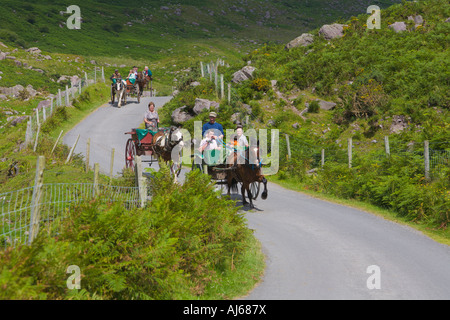 Tourists in Jaunting Cars 'Gap of Dunloe' County Kerry Ireland Stock Photo