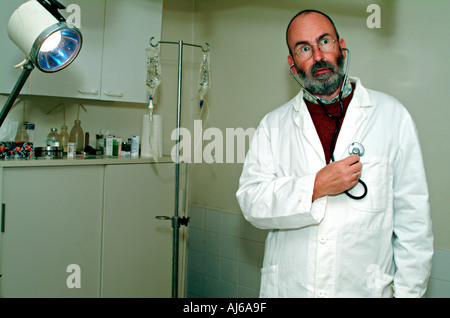despairing veterinarian examinates his heart Stock Photo