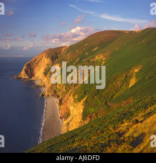 Countisbury Hill and Foreland Point with Sillery Sands at foot of steep cliffs and South Wales on horizon Lynmouth Devon England Stock Photo