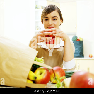 Young woman in the kitchen. Stock Photo