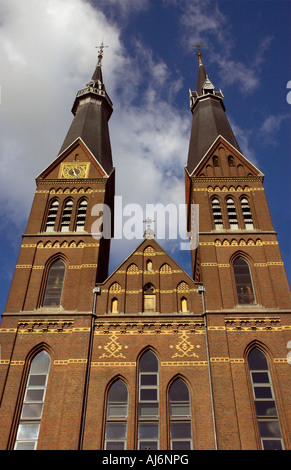 Looking up at the twin spires of Posthoornkerk in Amsterdam Stock Photo