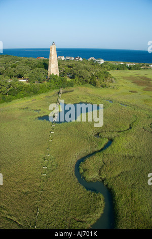 Aerial view of Old Baldy lighthouse in marshy lowlands of Bald Head Island North Carolina Stock Photo