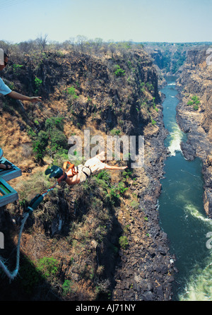 A young white man bungee jumping off the bridge at Victoria Falls Zimbabwe Stock Photo