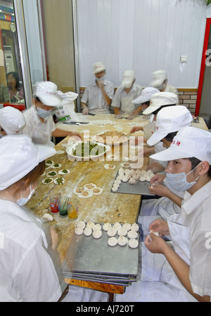 Preparing Food in a Beijing Chinese Restaurant Kitchen Stock Photo