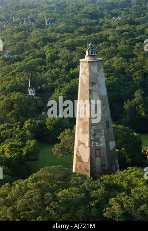 Aerial view of Old Baldy lighthouse in wooded park at Bald Head Island North Carolina Stock Photo