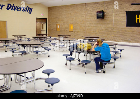 Student Studies alone After School in Cafeteria Stock Photo