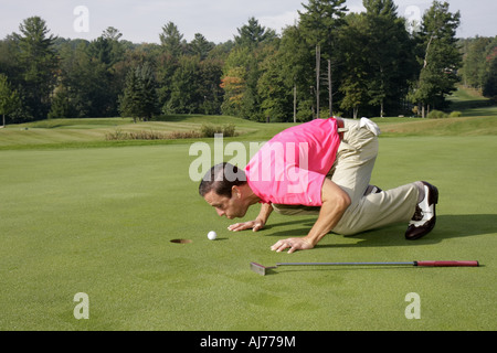 Pocono Poconos Mountains Pennsylvania,Hawley,The Country Club at Woodloch Springs,golf course,man men male,golfer,green,blowing ball,hole,funny,humor, Stock Photo