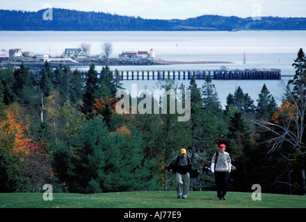 Two male golfers heading for the green on the Algonquin Golf Course in St Andrews By the Sea New Brunswick Canada Stock Photo