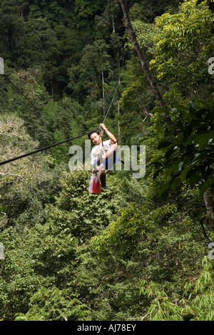 Guide arrives with a meal by zip line at The Gibbon Experience near Huay Xai on the Mekong river near the Laos Thai border Stock Photo