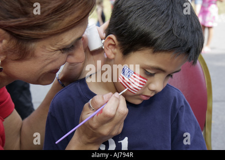 Pocono Poconos Mountains Pennsylvania,Hawley,Woodloch Resort,carnival,Asian boy,boys,child,face paint,US flag,PA070922087 Stock Photo