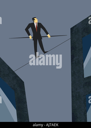 Business Balancing Act - Male executive walking on tightrope Stock Photo