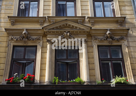 Windows overlooking Market Square in historic Krakow Poland. Krakow was on the very first UNESCO World Heritage List Stock Photo