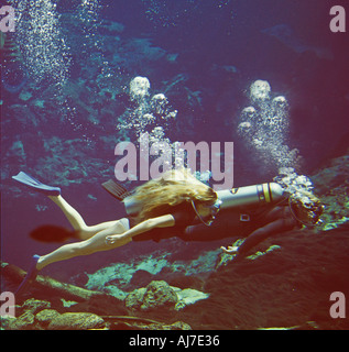 two skin divers cave diving in Florida spring Stock Photo