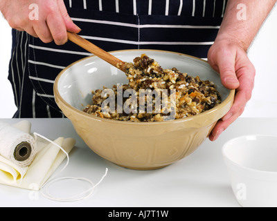 Mixing the ingredients for a traditional Christmas pudding in a large bowl Stock Photo