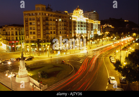 Light trails from traffic on the Paseo del Parque at night, Malaga, Andalucia, Spain Stock Photo