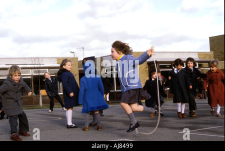 Children playing in school yard at primary school Stock Photo