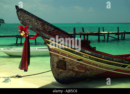 A longboat is pulled up on the beach, Koh Phi Phi Islands, Thailand Stock Photo