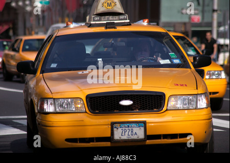 Taxis on Fifth Avenue in Midtown Manhattan New York NY Stock Photo