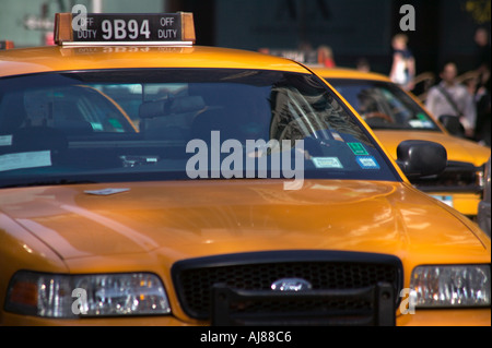 Taxis on Fifth Avenue in Midtown Manhattan New York NY Stock Photo