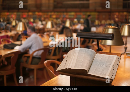 People reading and studying in the main reading room at the New York Public Library in Midtown Manhattan New York NY Stock Photo