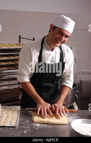Male baker in his bakery Stock Photo