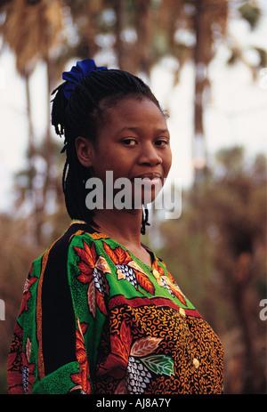 An attractive dignified African lady who is the National Park warden in traditional dress Zambezi National Park Zimbabwe Stock Photo