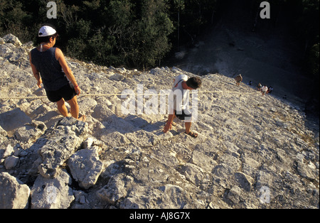 Tourists climbing the Nochoch Great Pyramid at the Mayan ruins of Cobá, Quintana Roo, Mexico Stock Photo