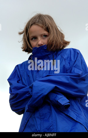 young girl outdoors in the winter, shivering with cold Stock Photo