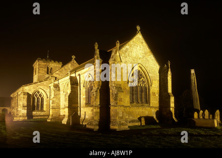 Rudston Monolith at night All Saints parish church Rudston East Yorkshire UK Stock Photo