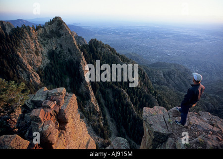 Man standing on rocky ridge. Stock Photo