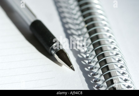 Close up of Spiral note pad notebook and pen Stock Photo